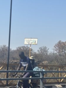 Welcome to Zambia sign at the Victoria Falls border between Zambia and Zimbabwe.